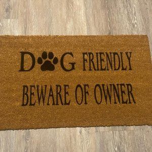 Coir Doormat with "Dog Friendly Beware of Owner" painted on it